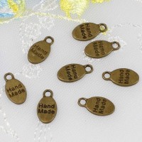 Chapita Hand Made Bronce REF. CM0067 Medida 15 x 8 mm Bolsita 10 unidades 1,70 euros 